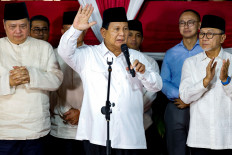 President-elect Prabowo Subianto waves while giving a speech in Jakarta on March 20, 2024, after the General Elections Commission (KPU) certified his victory in the 2024 presidential election. Prabowo won 58.58 percent of the vote, according to the final KPU tally.