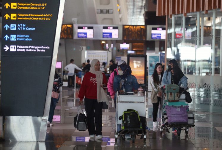 Travelers stroll through Terminal 3 of Soekarno-Hatta International
Airport in Tangerang, Banten, on March 21, 2024,  The Transportation Ministry has predicted the
peak Idul Fitri holiday season will occur between April 3 and 18, when the number of air
passengers will reach 4.4 million.