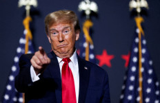 Republican presidential candidate and former United States president Donald Trump gestures on February 14 , 2024, at a campaign event ahead of the Republican presidential primary election in North Charleston, South Carolina, US. 