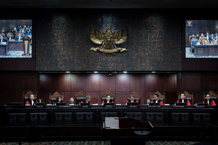 Chief Justice of the Constitutional Court of Indonesia Suhartoyo (fourth left) presides over the first hearing of the petition by presidential election challenger Anies Baswedan over the February 2024 elections, which was decisively won by Defense Minister Prabowo Subianto amid allegations of irregularities and fraud at the Constitutional Court in Jakarta on March 27, 2024.