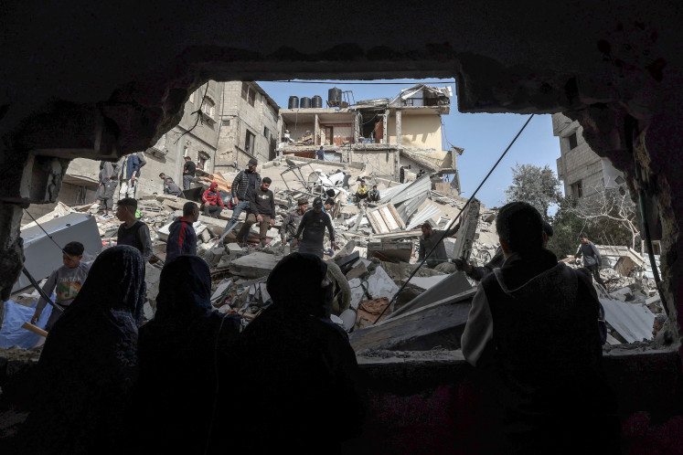 Palestinians check on March 27, 2024 the rubble of buildings in Rafah, southern Gaza, which were destroyed in overnight Israeli bombardment during its prolonged war on militant group Hamas in the occupied territory.