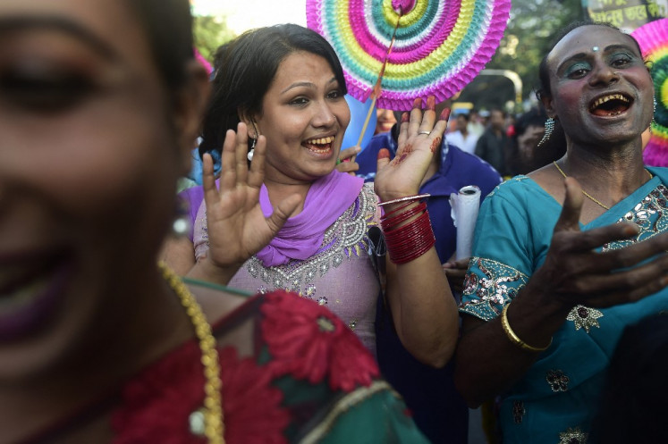 Bangladeshi hijras - transgenders - dance in the street during a rally to mark the first ever nationwide program to observe 'Hijra Day' in Dhaka on November 10, 2014. 