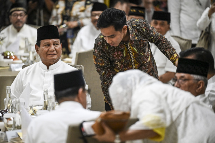 President-elect Prabowo Subianto (left) and vice president-elect Gibran Rakabuming Raka (center) attend a breaking-of-the-fast event hosted by the Golkar Party on March 29, 2024 in Jakarta.