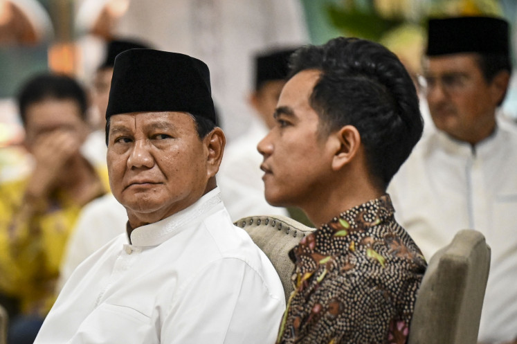 President-elect Prabowo Subianto (left) and vice president-elect Gibran Rakabuming Raka attend a breaking-o-the-fast event hosted by the Golkar Party on March 29, 2024, in Jakarta.