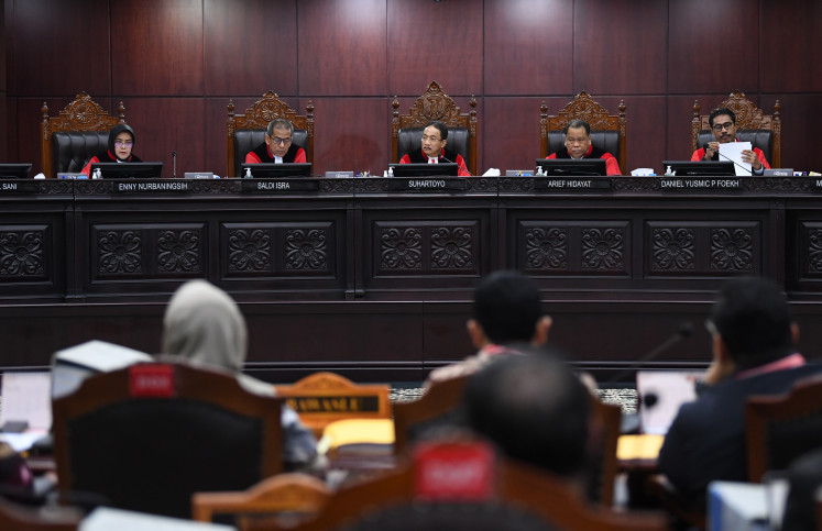 Constitutional Court Chief Justice Suhartoyo (center, rear) sits on a five- member panel with fellow justices (from left) Enny Nurbaningsih, Saldi Isra, Arief Hidayat and Daniel Yusmic Pancastaki Foekh as he presides over a hearing on Arpil 2, 2024, in the
election dispute filed by the Ganjar Pranowo-Mahfud MD presidential pair.
