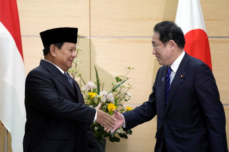 Indonesian president-elect and current Defense Minister Prabowo Subianto (left) and Japan's Prime Minister Fumio Kishida shake hands at the prime minister's office in Tokyo on April 3, 2024.