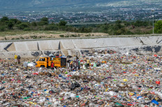 A truck dumps garbage on April 2, 2024, at the Kawatuna landfill in Palu, Central Sulawesi. The local sanitation agency recorded that up to 270 tonnes of waste were dumped per day at the site during the fasting month of Ramadan, an increase of 35 percent from the usual daily average of 200 tonnes.

