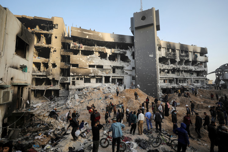 Palestinians inspect damages at al-Shifa Hospital on April 1, 2024,
after Israeli forces withdrew from the hospital and the area around it following a
two-week operation in Gaza City.