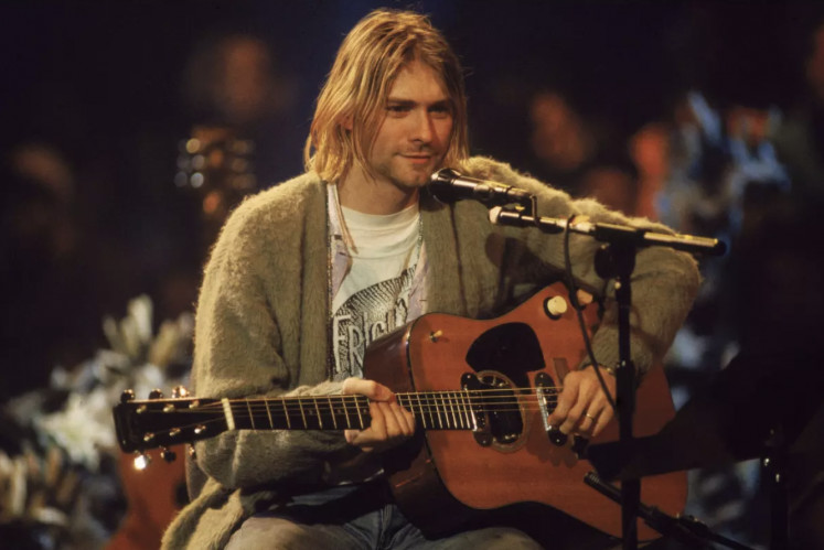 Nirvana singer and guitarist Kurt Cobain performs in 1993 in New York during a taping of “MTV Unplugged.” 