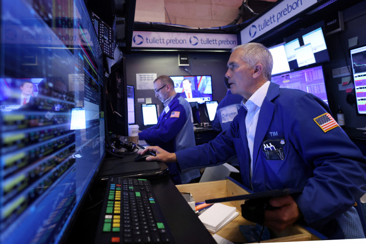 Traders work on the trading floor at the New York Stock Exchange (NYSE) in New York City, US, on April 4, 2024.