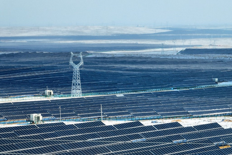 This aerial photo taken on Jan. 21, 2024, shows solar panels in the snow-covered Gobi desert in Yinchuan, in Chinas northern Ningxia region.
