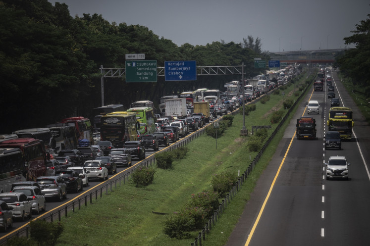 Motorists are stuck in bumper-to-bumper traffic on April 5, 2024 at Kilometer Marker 150 of the Cikopo-Palimanan (Cipali) toll road in Mekarjaya, West Java.