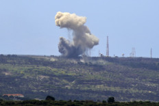 A picture taken from the southern Lebanese village of Alma al-Shaab shows smoke rising from an Israeli outpost after a rocket attack by Lebanon's Hezbollah movement fighters on April 6, 2024. 