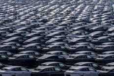 New electric cars for sale are parked at a distribution center of the Changan automobile company in southwestern China's Chongqing municipality, on March 24, 2024.