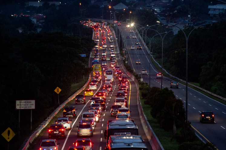 Heavy traffic is seen on a toll road on April 6, 2024, as people return to their hometowns ahead of Idul Fitri, which marks the end of the Muslim fasting month of Ramadan, in Semarang, Central Java.