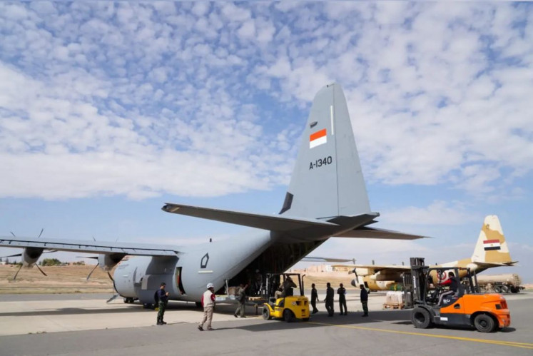 Ground crew load humanitarian aid for Palestinians in Gaza onto an Indonesian Air Force C-130J Super Hercules aircraft on April 9, 2024 at King Abdullah II Air Base in Zarqa, Jordan.