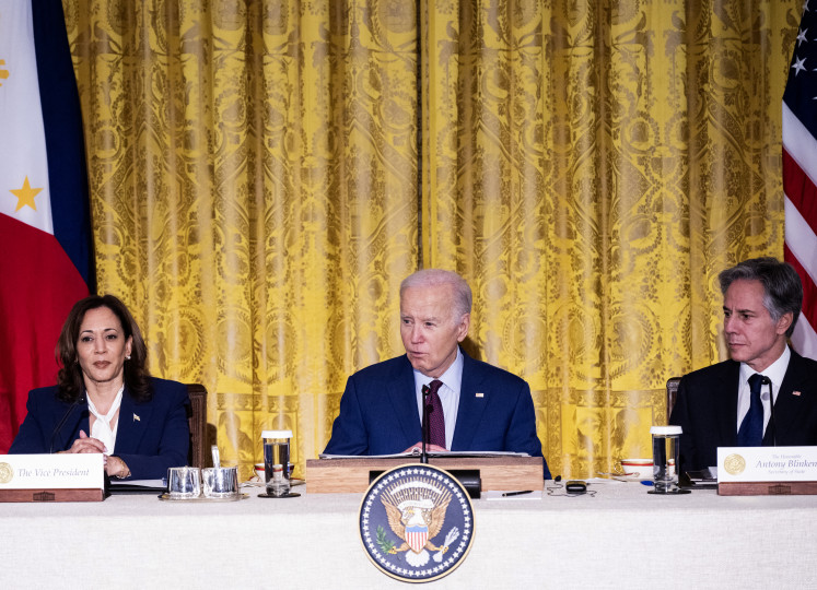 US President Joe Biden (center), Secretary of State Antony Blinken (right), and US Vice President Kamala Harris look on during a trilateral meeting with Japanese Prime Minister Fumio Kishida and Filipino President Ferdinand Marcos Jr. in the East Room of the White House in Washington, DC, on April 11, 2024.