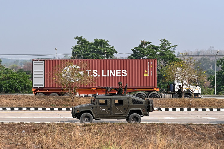 A truck coming from Myanmar waits to cross over into Thailand at the 2nd Thai-Myanmar Friendship Bridge in Thailand's Mae Sot district on April 12, 2024. 