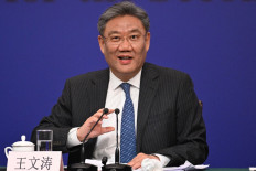 China's Minister of Commerce Wang Wentao answers a question at a press conference during the second session of the 14th National People's Congress (NPC) in Beijing on March 6, 2024.