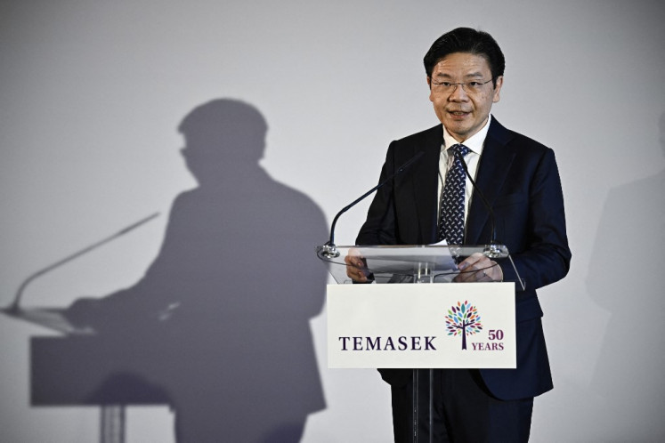 Singapore's Deputy Prime Minister and Minister for Finance Lawrence Wong delivers a speech during the Paris office opening reception of Singapore state investor Temasek, on April 10, 2024 in Paris. 