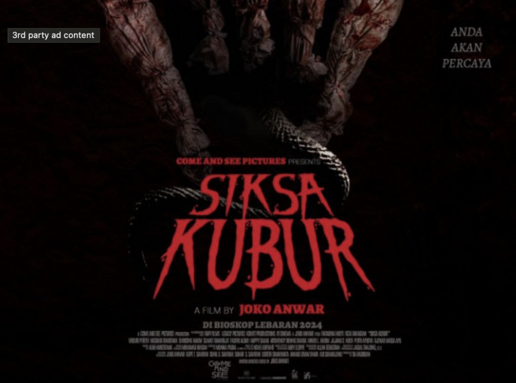 A poster for Indonesian horror flick "Siksa Kubur" (Grave Torture), which is just released recently at cinemas. 