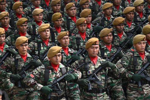 Up in arms: Army personnel march during celebrations to mark the 78th anniversary of the Indonesian Military (TNI) in Banda Aceh, Aceh, on Oct. 5, 2023.