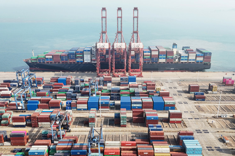 Shipping containers are stacked on April 12, 2024, at a port in Lianyungang, in
eastern China's Jiangsu province. Chinese exports plunged more than expected in
March, official figures show, as the world's second-largest economy struggles to
sustain its post-pandemic recovery.