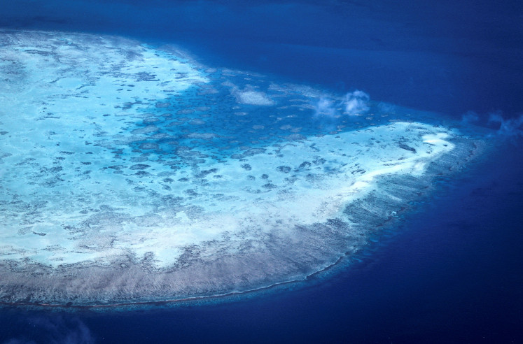A coral atoll near Lizard Island on the Great Barrier
Reef, 270 kilometers north of the city of Cairns, Australia, is
pictured on April 4, 2024. Australia's famed reef is teetering on the
brink, suffering one of the most severe coral bleaching events
on record, the fifth in eight years, and leaving scientists unsure
about its survival.