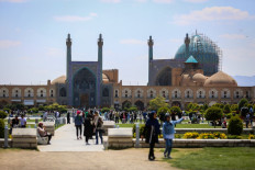 People visit the Naqsh-e Jahan Square in front of the Shah Mosque in Iran's central city of Isfahan on April 19, 2024. World leaders appealed for calm on April 19 after reported Israeli retaliation against Iran added to months of tense spillover from the war in Gaza, with Iranian state media reporting explosions in the central province of Isfahan.