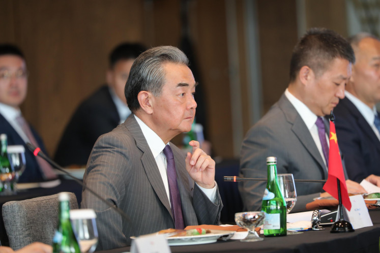 Chinese Foreign Minister Wang Yi gestures during the fourth high level dialogue and cooperation mechanism (HDCM) between Indonesia and China in Labuan Bajo, East Nusa Tenggara on April 19, 2024.