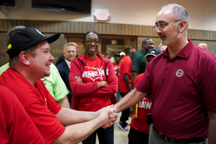 President of the United Automobile Workers (UAW) Shawn Fain greets people after the result of a vote comes in favour of the hourly factory workers at Volkswagen's assembly plant to join the United Auto Workers (UAW) union, at a watch party in Chattanooga, Tennessee, US, on April 19, 2024.
