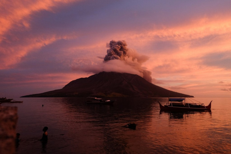 Mount Ruang volcano erupts in Sitaro, North Sulawesi, on April 19, 2024. The remote volcano sent a tower of ash spewing into the sky, after nearly half a dozen eruptions earlier this week forced thousands to evacuate when molten rocks rained down on their villages.