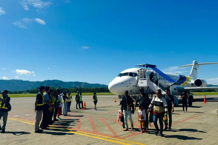 Passengers arrive at Pattimura International Airport on TransNusa Airlines inaugural Sorong-Ambon flight in Ambon, Maluku on Thursday, April 18, 2024. The Sorong-Ambon flight used COMAC ARJ21-799 aircraft and was part of TransNusa's route expansion in Eastern Indonesia. 