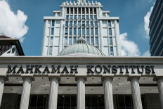 Bright clouds are suspended in blue skies on April 22, 2024 over the iconic domed structure of the Constitutional Court in Gambir, Central Jakarta.