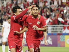 Indonesian soccer team player Marselino Ferdinan (right) celebrates after scoring a goal from the penalty kick in the 23rd minute during the 2024 Asian Football Confederation (AFC) Under-23 Asia Cup Group A match against Jordan at Abdullah bin Khalifa Stadium in Doha, on April 21, 2024. Marselino contributed two goals as Indonesia won 4-1 and entered the quarterfinals for the first time.  