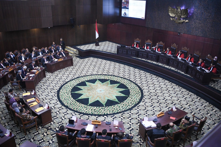 Eight Constitutional Court justices (right) deliver their rulings on the 2024 presidential election result dispute in a hearing on April 22, 2024. The court rejected all petitions filed by losing presidential candidate pair Anies Baswedan-Muhaimin Iskandar and Ganjar Pranowo-Mahfud MD.