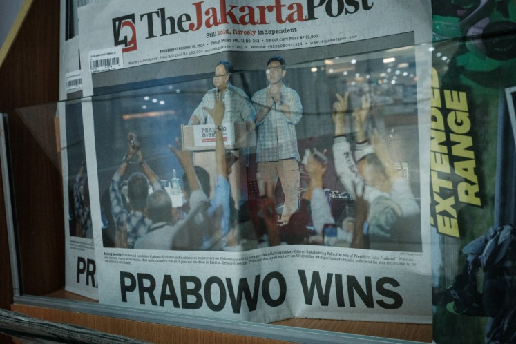 The front page of The Jakarta Post newspaper shows Defense Minister Prabowo Subianto (left) and Surakarta Mayor and President Joko “Jokowi“ Widodo's eldest son Gibran Rakabuming Raka at a book store a day after the countrys presidential and legislative elections in Jakarta on February 15, 2024.
