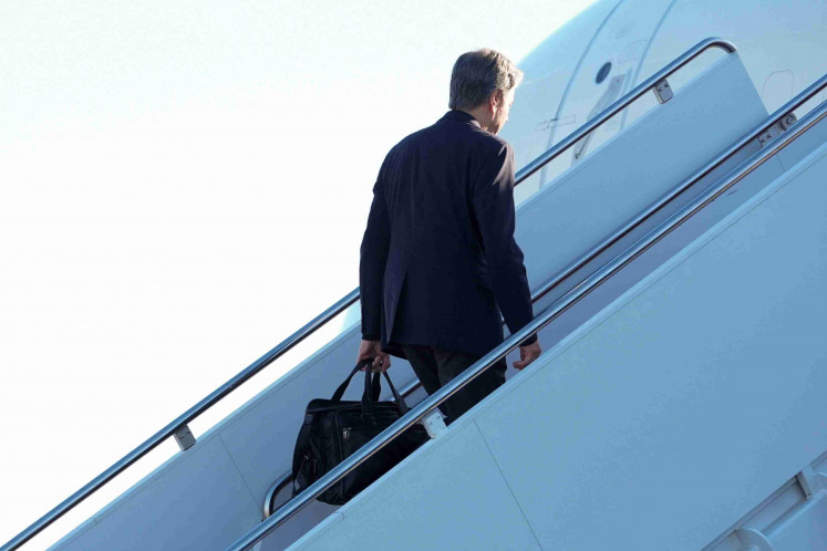 US Secretary of State Antony Blinken boards a plane, en route to China, at Andrews Air Force Base, Maryland, US, April 23, 2024. 