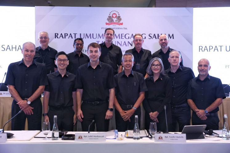 Members of the board of directors and commissioners of PT HM Sampoerna (Sampoerna) pose for a photo after the annual general meeting of shareholders in Jakarta on April 23. During the meeting, shareholders also approved the appointment of Ivan Cahyadi (front, second from left) as the new president director of Sampoerna, replacing Vassilis Gkatzelis (front, third from left), effective from May 1, as well as the appointment of Yohan Lesmana as a director of the company.