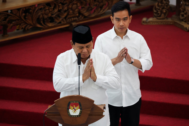 President-elect Prabowo Subianto and vice president-elect Gibran Rakabuming Raka gesture before delivering their speech at General Election Commission (KPU) headquarters during the country's election commission officially announcing the presidential election winners in Jakarta, April 24, 2024. 
