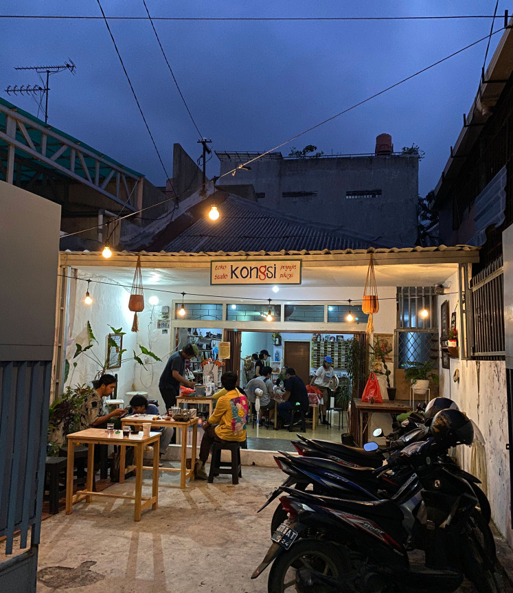 Modest hangout: Customers lounge on Sept. 4, 2022, at Kongsi, a creative hub located in Jatinegara, East Jakarta. (Courtesy of Harriet Crisp)