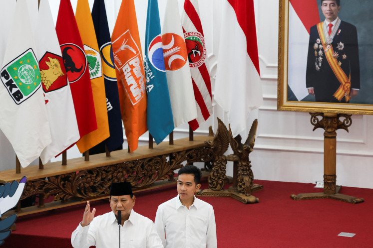 President-elect Prabowo Subianto (left), alongside
vice president-elect Gibran Rakabuming Raka, delivers a
speech in Jakarta on April 24, 2024, after the General Elections
Commission (KPU) declared the pair the official winners of the
2024 presidential election.