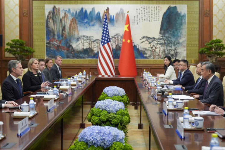 United States Secretary of State Antony Blinken (left) attends a meeting with China's Foreign Minister Wang Yi (right) at the Diaoyutai State Guesthouse in Beijing on April 26, 2024. 