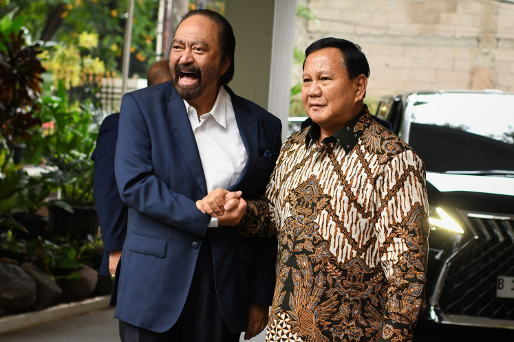 President-elect and Gerindra Party chair Prabowo Subianto (left) embraces National Awakening Party (PKB) chair Muhaimin Iskandar (right) after a meeting between both parties at the PKB headquarters in Jakarta on April 24, 2024. Muhaimin, who ran with Prabowo's rival Anies Baswedan in the Feb. 14 election, expresses the party's wish to work with Gerindra during Prabowo's presidency.