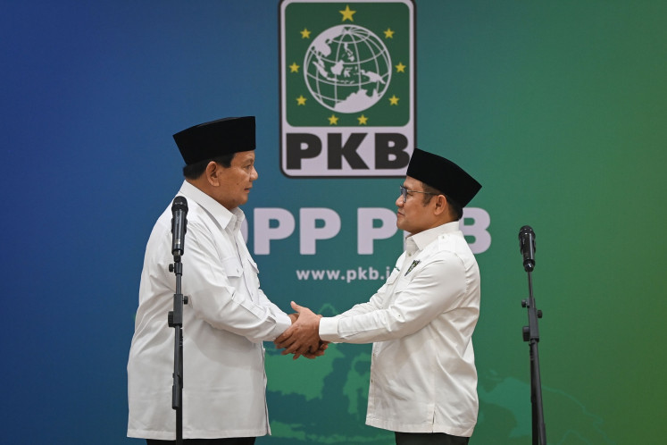 President-elect and Gerindra Party chair Prabowo Subianto (left) shakes hands with National Awakening Party (PKB) chair Muhaimin Iskandar (right) after a meeting between both parties at the PKB headquarters in Jakarta on April 24, 2024. Muhaimin, who ran with Prabowo's rival Anies Baswedan in the Feb. 14 election, expressed the party's wish to work with Gerindra during Prabowo's presidency.