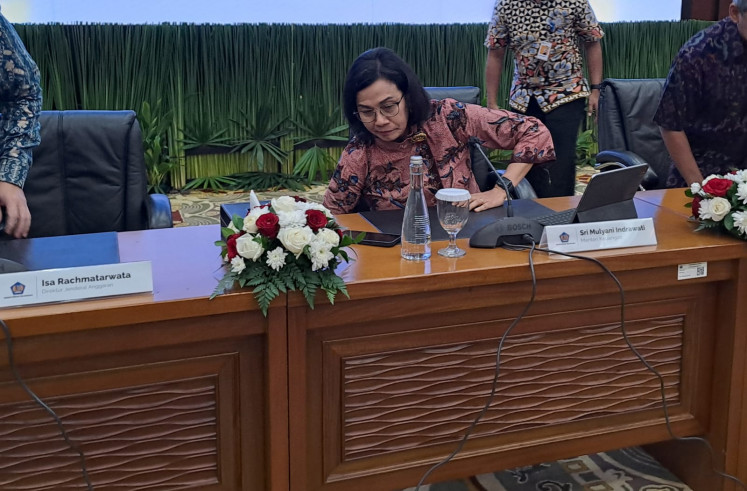 Finance Minister Sri Mulyani Indrawati sits down in a desk to press the brief about the state budget in her Jakarta office on Apr. 26, 2024.