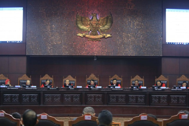 The nine justices of the Constitutional Court preside over a hearing. 