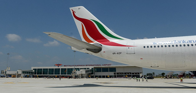 A Sri Lankan airlines Airbus A-340 carrying President Mahinda Rajapakse who became the first passenger to go through the facility, lands at the new Mattala Rajapaksa International Airport in Mattala, in the southeast of the island on March 18, 2013.  Sri Lanka's president opened the country's second international airport on Monday which is intended to help spur a new economic hub and act as a gateway to the island's southeast. 
