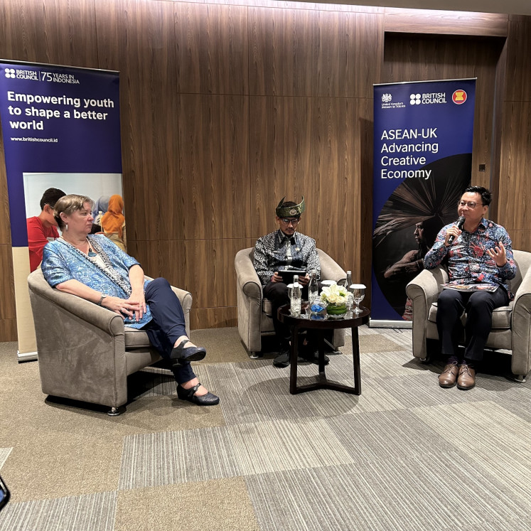 The British Council’s Indonesia country director and Southeast Asia director Summer Xia (right) speaks on March 26, 2024 during a creative economy roundtable in Jakarta, along with British Ambassador to ASEAN Sarah Tiffin (left) and Indonesian Tourism and Creative Economy Minister Sandiaga Uno, to mark the institution’s 75th anniversary in the region.
