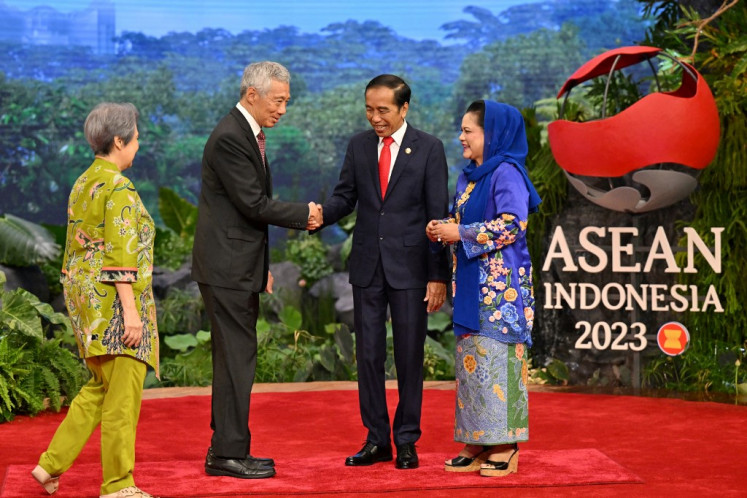 Singaporean Prime Minister Lee Hsien Loong (second left) and his spouse Ho Ching (left) are welcomed by President Joko “Jokowi“ Widodo (second right) and First Lady Iriana Widodo upon their arrival for the ASEAN Summit in Jakarta on September 5, 2023.